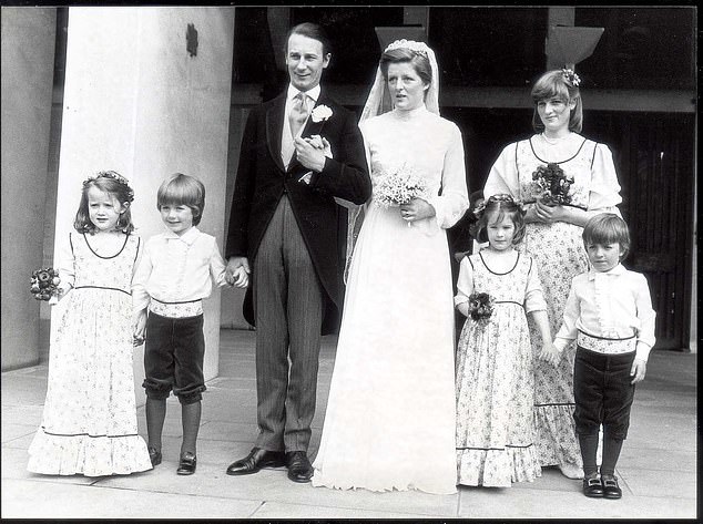 Flanked by bridal attendants,  the former Lady Jane Spencer, 21, poses outside the Guard's Chapel, Wellington Barracks after her marriage to Mr Robert Fellows, 35. The bride, daughter of Earl Spencer, is the sister of Lady Sarah Spencer and Lady Diana Spencer