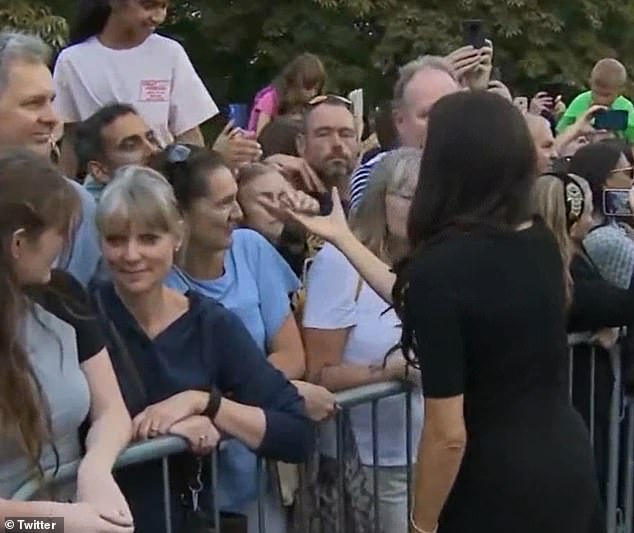 Meghan was ignored by one well-wisher, who was paying her respects to the late Queen, after attempting to shake her hand