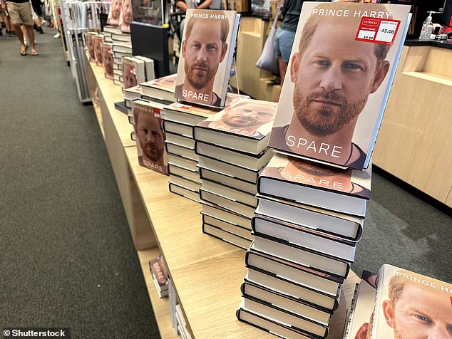 Prince Harry's memoir Spare (pictured here at launch in a bookstore in Australia) also drove a further wedge between him and his family