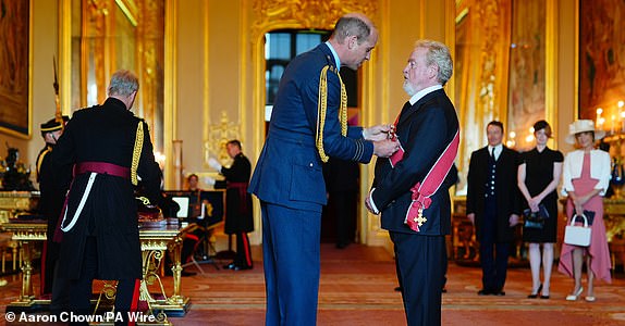 Sir Ridley Scott, from Los Angeles, Director and Producer, is made a Knight Grand Cross of the Order of the British Empire by the Prince of Wales at Windsor Castle. The honour recognises services to the UK film industry.   Picture date: Wednesday May 8, 2024. PA Photo. See PA story ROYAL Investiture. Photo credit should read: Aaron Chown/PA Wire