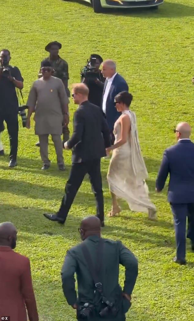 Meghan and Harry turned up to the event hand-in-hand, both grinning with apparent excitement