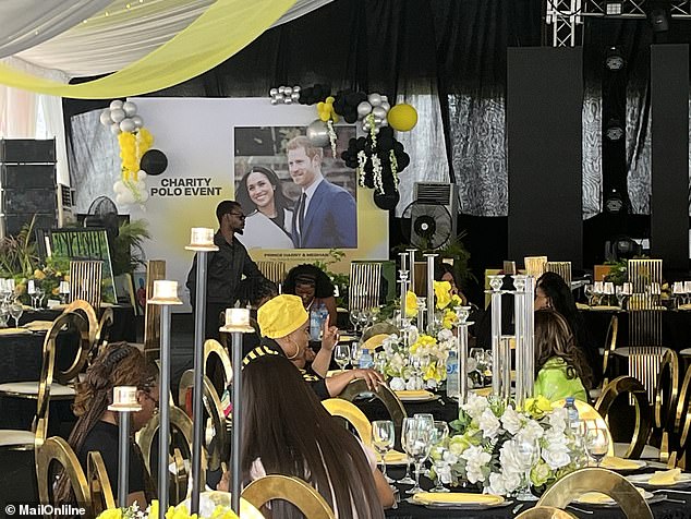 Waiters and kitchen porters were setting up a huge air conditioned marquee for the dinner