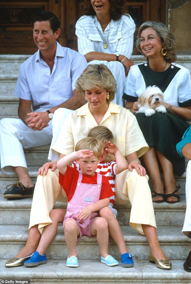 Wearing a yellow jumpsuit, Diana can be seen putting all her attention to Princes William and Harry while on holiday in Palma, Majorca, in 1987.