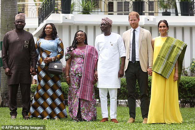 Harry pictured this month in Lagos with wife Meghan Markle (far right) and Nigeria Chief of Defense Staff Christopher Musa (far left), his wife Lilian Musa (second left), Lagos State Governor, Babajide Sanwo-Olu (third right) and his wife, Ibijoke Sanwo-Olu (third left)