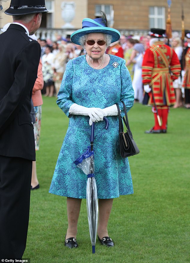 The Queen wears dark sunglasses at a garden party at Buckingham Palace in 2018