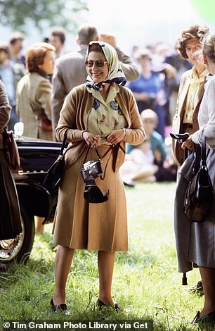 Queen Elizabeth II watches the International Driving Grand Prix in Windsor in 1982