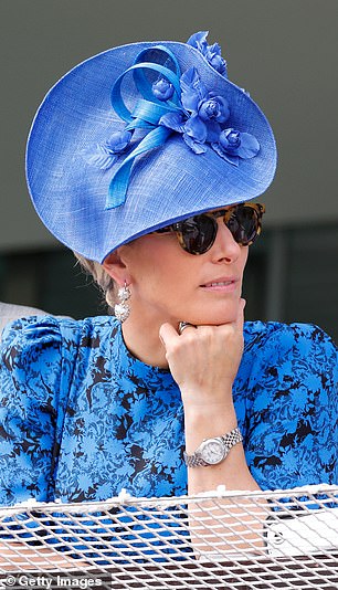 Zara Tindall watches the racing from the royal box at Epsom Racecourse in 2022