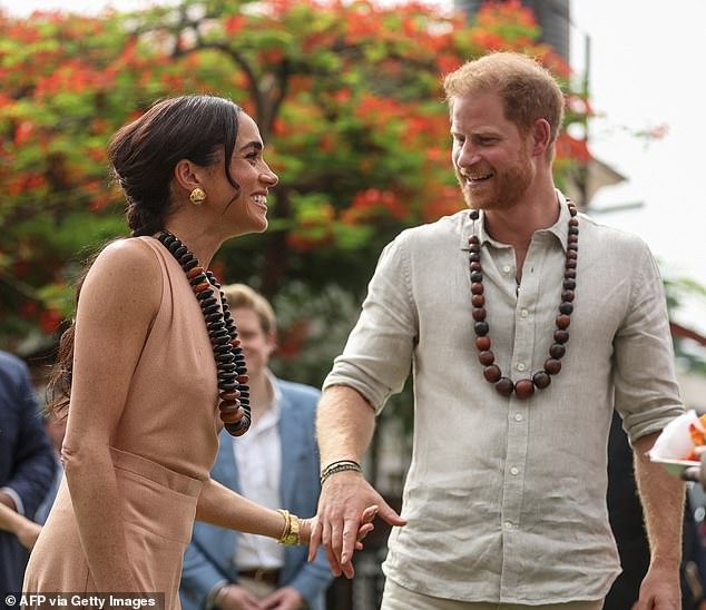 Meghan complemented her outfit with a smattering of glamorous makeup, including a pink lip-gloss, plenty of blush and a smokey eyeshadow look