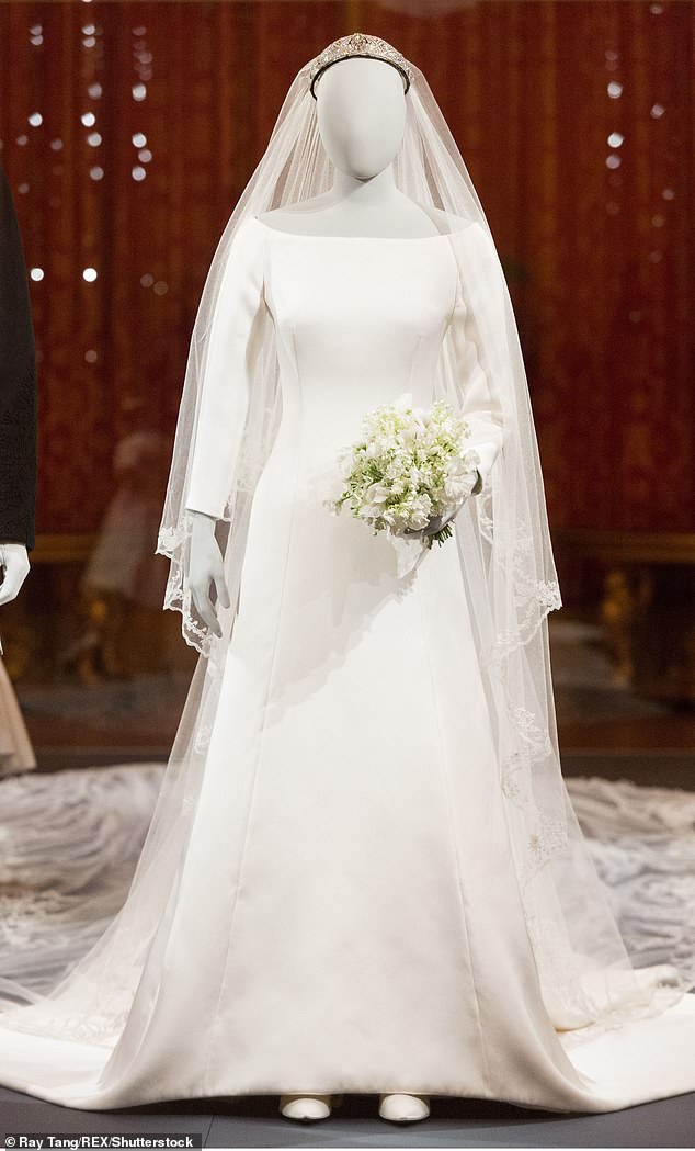 Meghan's veil was held in place by the Queen Mary's diamond bandeau tiara, which was originally made in 1932 and lent to Meghan by the late Queen Elizabeth