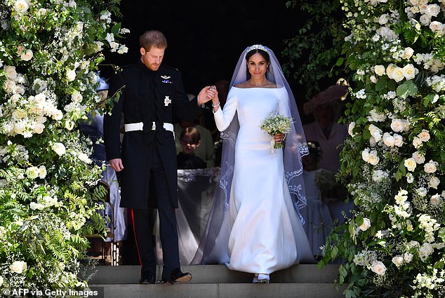 Meghan added a personal touch, stitching a piece of blue gingham fabric from the dress she wore on her first date with Harry in the hem