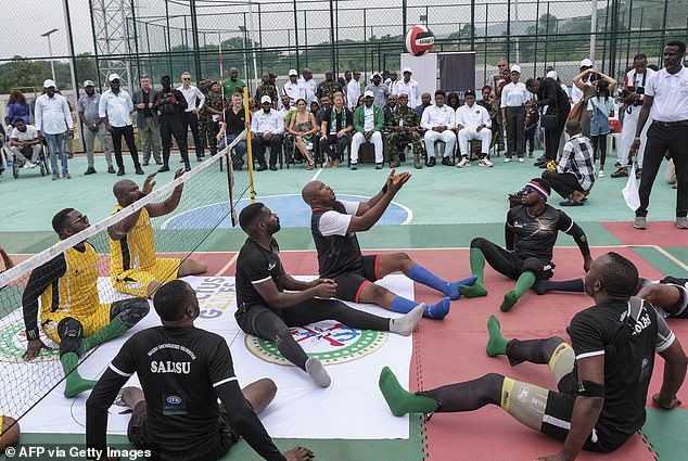 Members of the Nigeria Unconquered team can be seen here on the left, dressed in yellow, while players on the Chief of Defence staff squad are seen wearing black