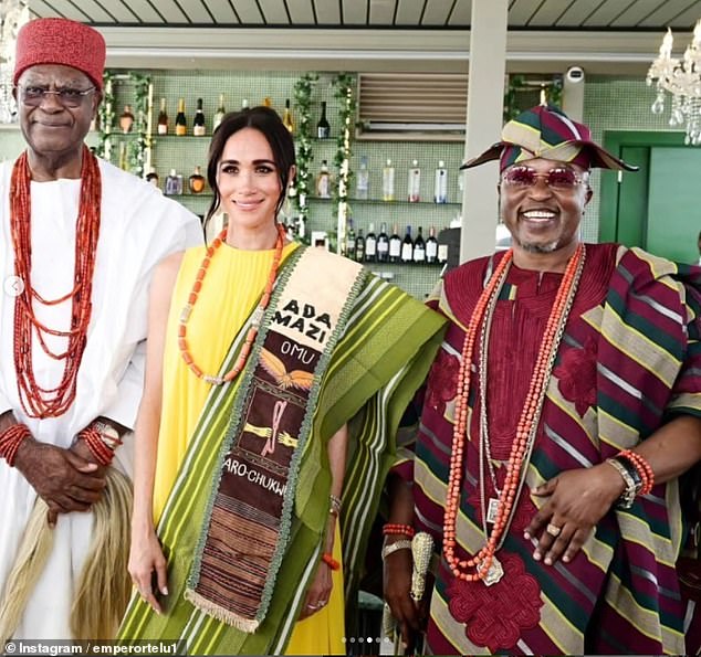 Pictured: Meghan Markle seen meeting Yoruba King, Oluwo of Iwo (right), during her quasi-royal tour of Nigeria