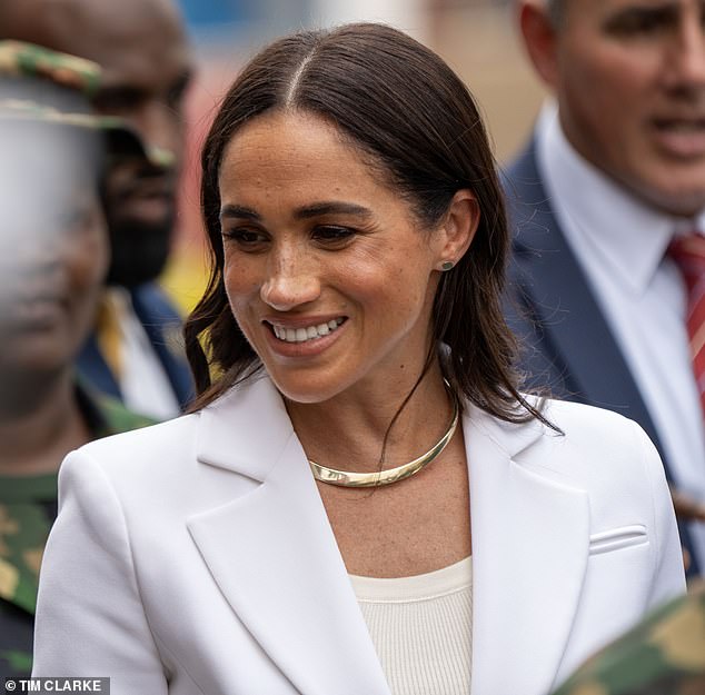 For her latest outfit, Meghan teamed her elegant blazer with matching Altuzarra suit trousers and donned a white T-shirt underneath her jacket