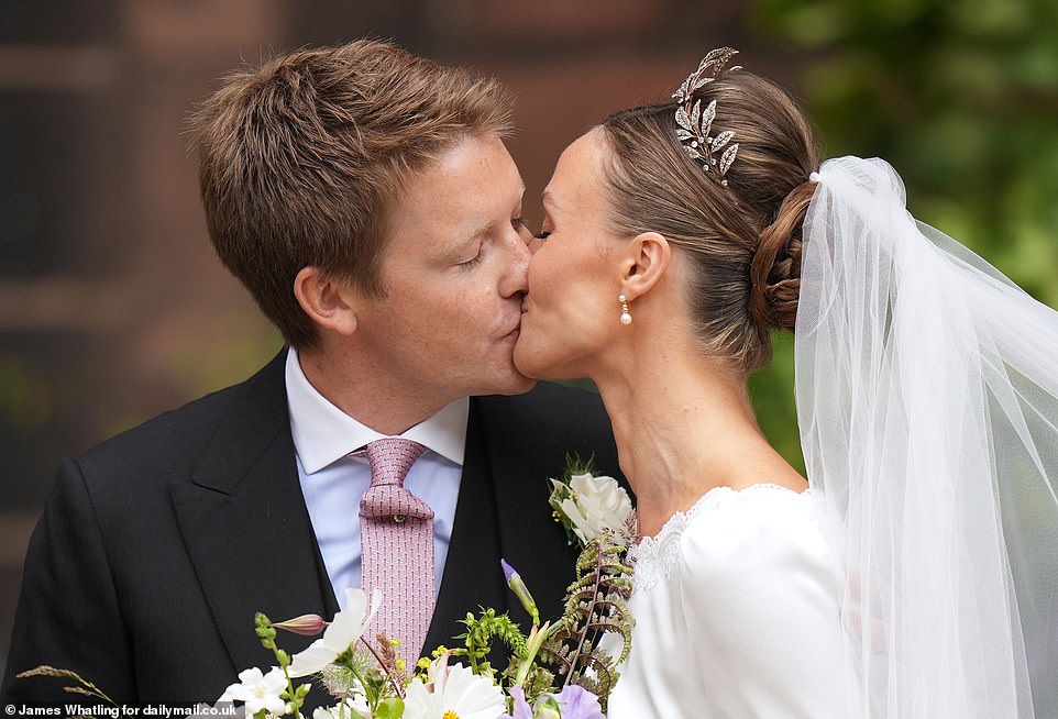 This was the moment the Duke of Westminster and Olivia Henson sealed the society wedding of the year with a kiss in front of guests