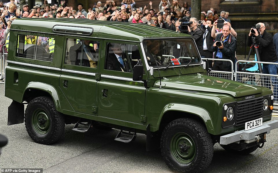 Grosvenor (pictured in the passenger seat) and his groomsmen arrived at Chester Cathedral in a Land Rover this afternoon