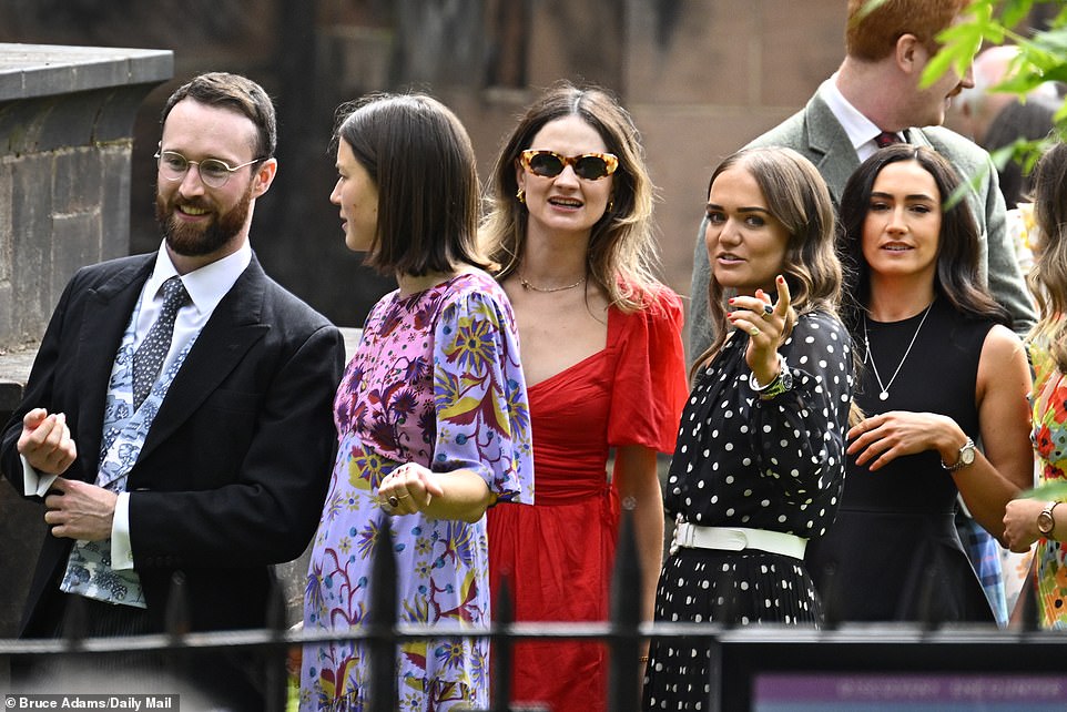 Guests arriving at Chester Cathedral in Cheshire for the wedding