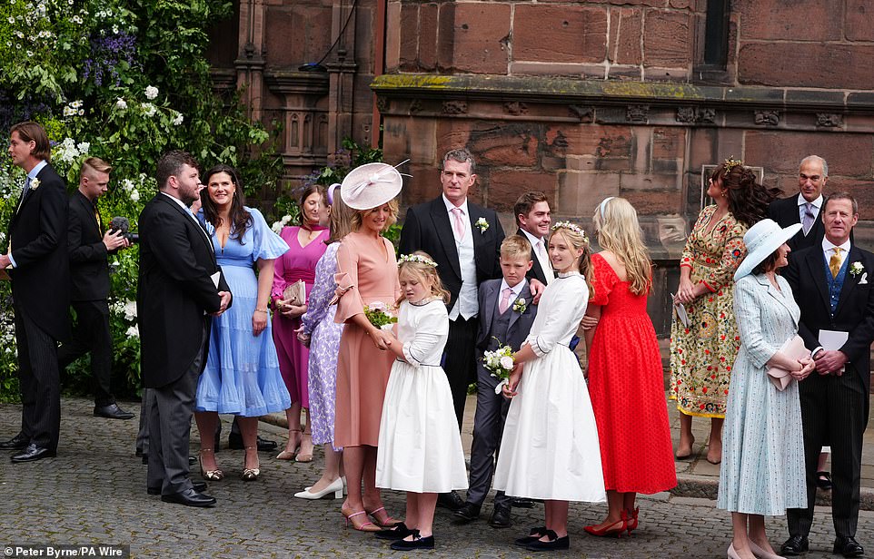 Gusts leave Chester Cathedral after the society wedding of the year in Cheshire this afternoon