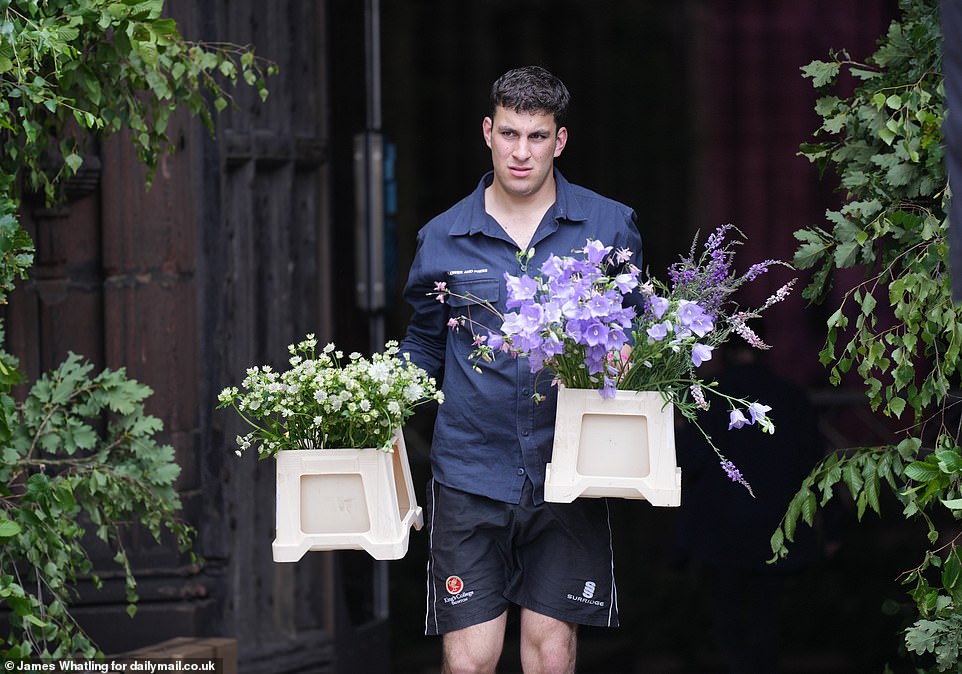 Scores of boxes of flowers were delivered to the cathedral by a fleet of vans