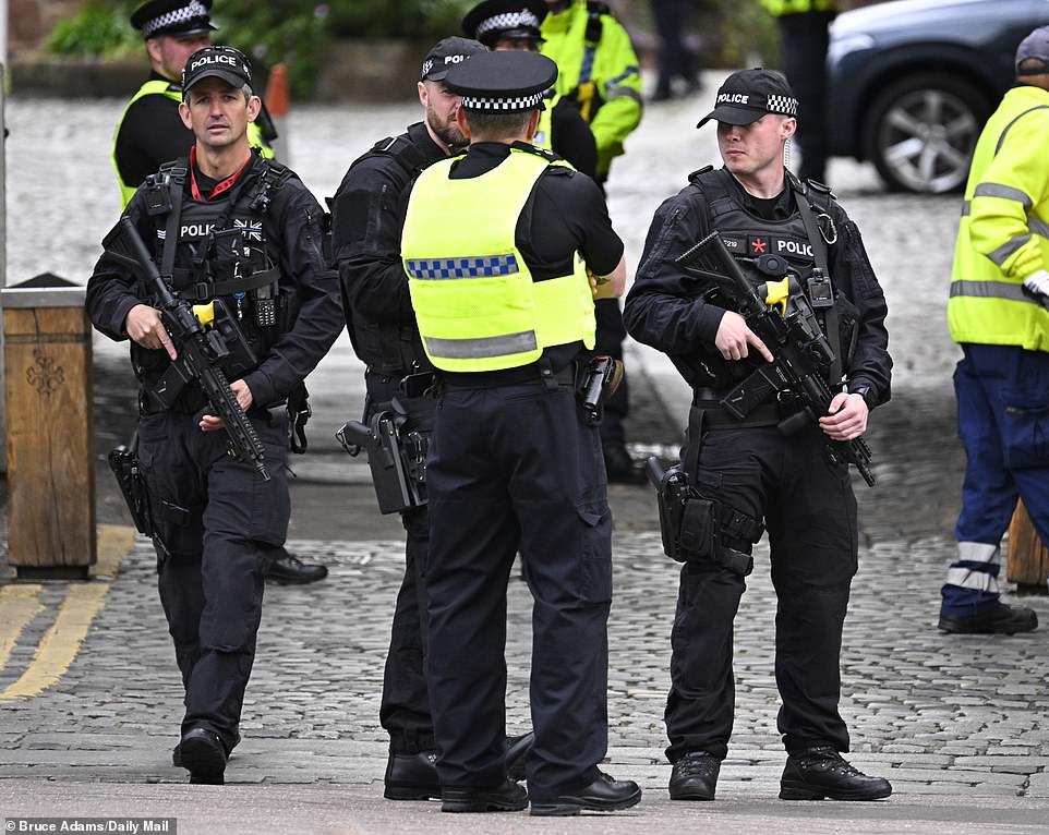 Police officers outside the cathedral in Cheshire today ahead of the ceremony