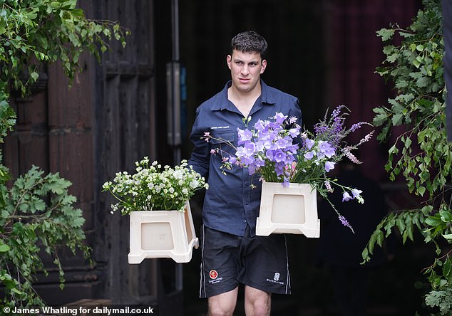 Scores of boxes of flowers were delivered to the cathedral by a fleet of vans