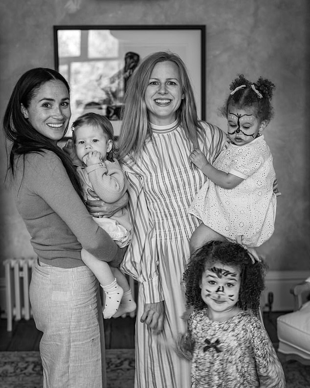 Photos shared by pal of the Sussexes and professional photographer Misan Harriman include a snap of Meghan holding Lilibet while standing with the photographer's wife Camilla Holmstroem and their two daughters at Lilibet's 1st birthday