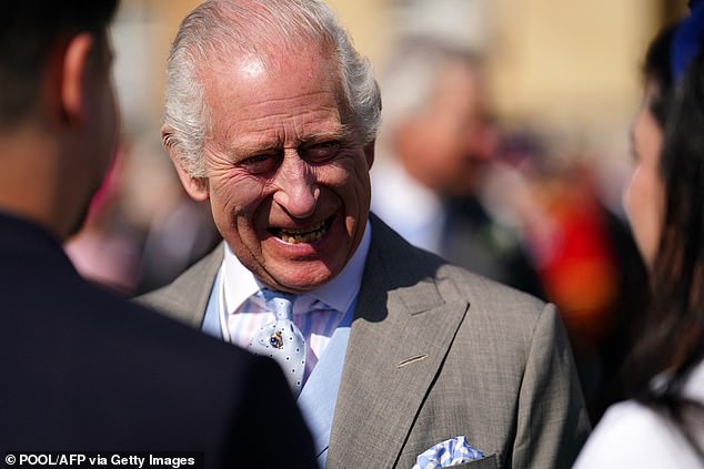 King Charles appeared to be on good form as he spoke to guests at royal garden party at Buckingham Palace on May 8