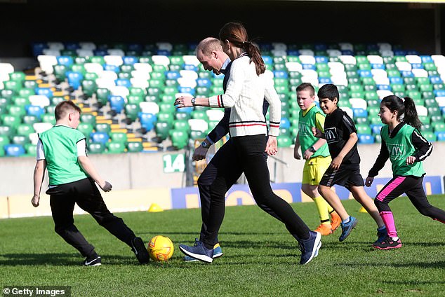 She got stuck in with excited school children and showed off her footballing skills in a spirited kickaround