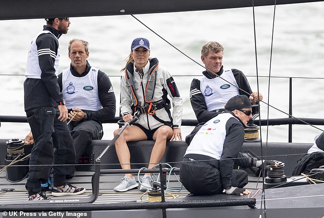 Despite being seen with face of fierce concentration as she worked with her team, she came last in the race and was awarded a giant wooden spoon, much to her amusement