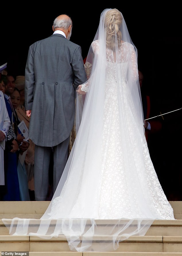 Gabriella's delicate veil was made from layers of white tulle and embroidered flowers