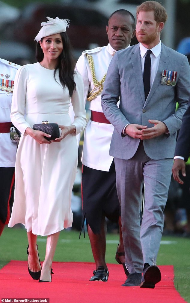 This ivory Zimmermann frock topped with a Stephen Jones fascinator, made Meghan look every bit the modern bride