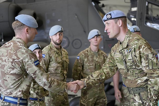 The Prince of Wales speaks to service personnel after the King gave him the role of Colonel-in-Chief of the Army Corps