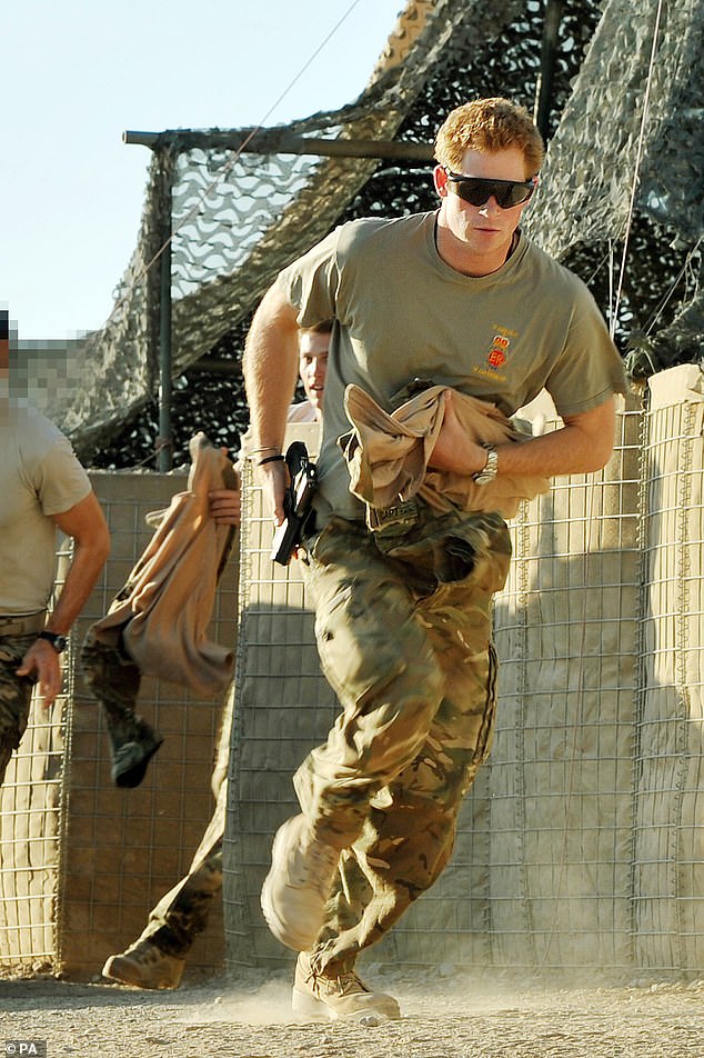 Prince Harry races out of a tent to scramble his Apache with fellow pilots