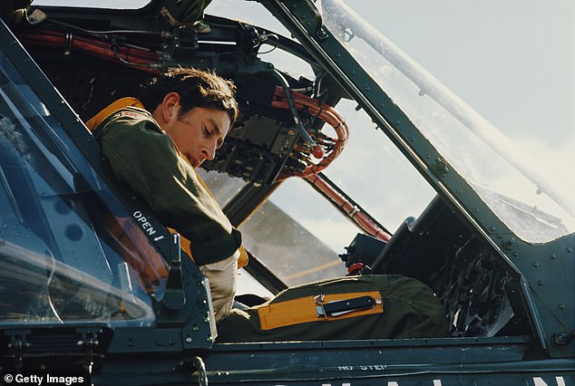 The future King sis in the cockpit of a Royal Navy helicopter in Somerset