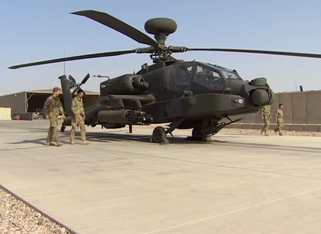 Prince Harry spent five months as an Apache commander and co-pilot gunner during his stint in Afghanistan (he is pictured inspecting one of the helicopters)