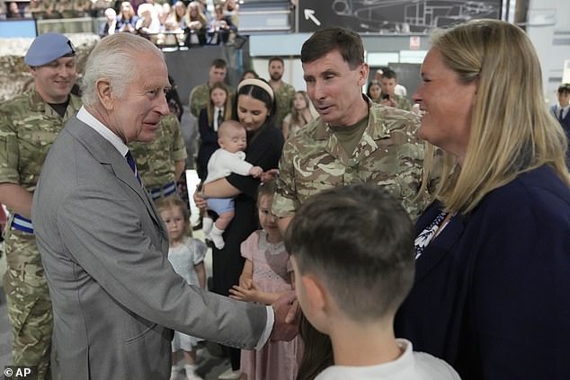 King Charles III meets staff members and their families at the Army Aviation Centre today