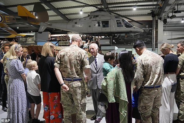 King Charles III meets staff members and their families at the Army Aviation Centre today