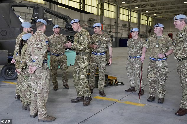 Prince William speaks to service personal at the Army Aviation Centre in Middle Wallop today