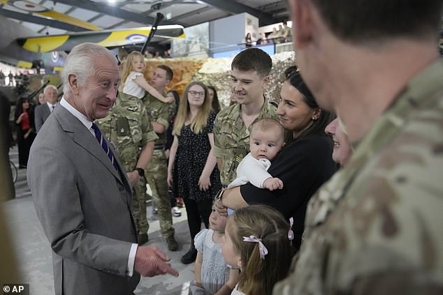 King Charles III meets staff members and their families at the Army Aviation Centre today