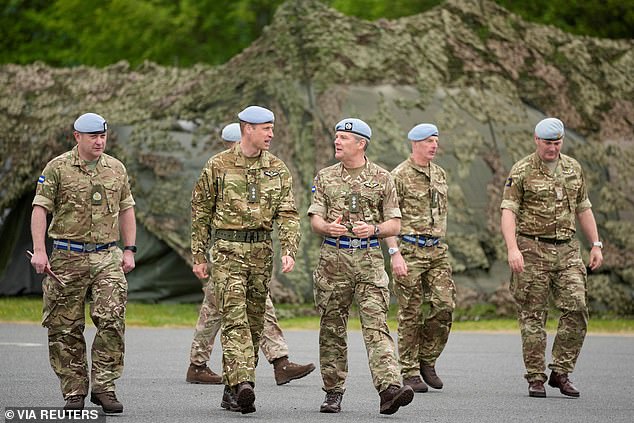 Prince William speaks to service personal at the Army Aviation Centre in Middle Wallop today