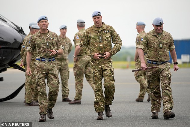 Prince William speaks to service personal at the Army Aviation Centre in Middle Wallop today