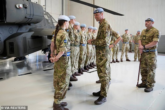 Prince William speaks to service personal at the Army Aviation Centre in Middle Wallop today