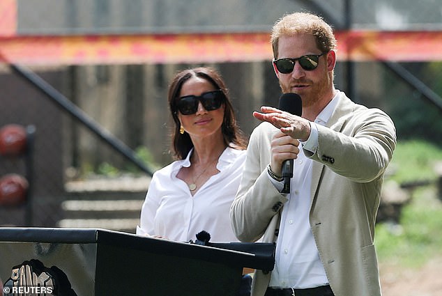 Harry sported sunglasses, a beige jacket, and a white shirt as he spoke at today's event in Lagos