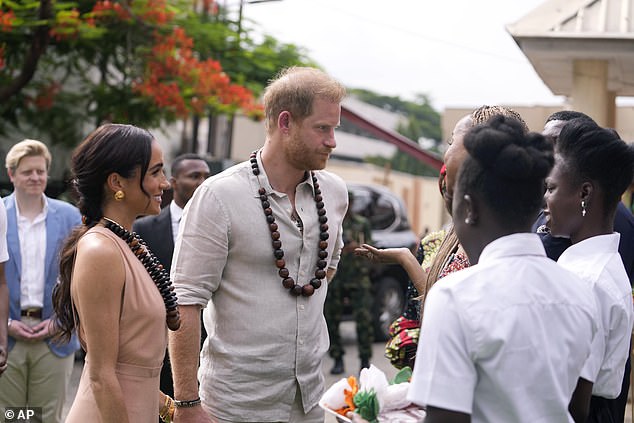 Both the Duchess and Duke donned beaded necklaces, while Harry put on a low-key display in a cream shirt and trouser combo