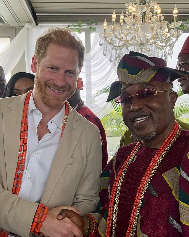 Prince Harry shaking hands with conman Oba Abdulrasheed Adewale Akanbi in Lagos, Nigeria