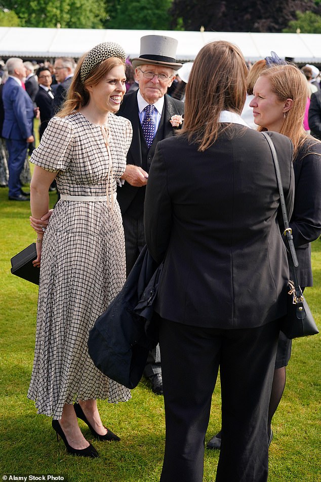 For a Buckingham Palace garden party in 2022, Princess Beatrice wore a Self-Portrait dress featuring a fun check print, flattering fit and flare silhouette and a round neckline finished with a delicate pink bow