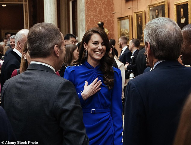 At King Charles's pre-Coronation reception last May, Kate stunned in a patriotic royal blue Self-Portrait dress with a criss-cross neckline. She also wore the Queen Mother's sapphire and diamond earrings, together with a sparkly silver clutch by Jenny Packham