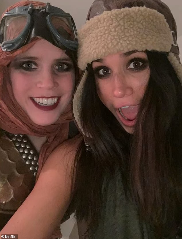 In another snap from the big night out, Meghan could be seen posing for a playful selfie with Princess Eugenie