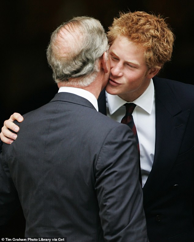 Prince Harry is pictured greeting his father during the 10th Anniversary Memorial Service For Diana, Princess of Wales in 2007