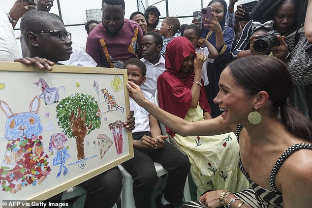 The Sussex Squad ¿ a group of Harry and Meghan fans ¿ were out in force as they cheered the Duke and Duchess on their arrival just before midday