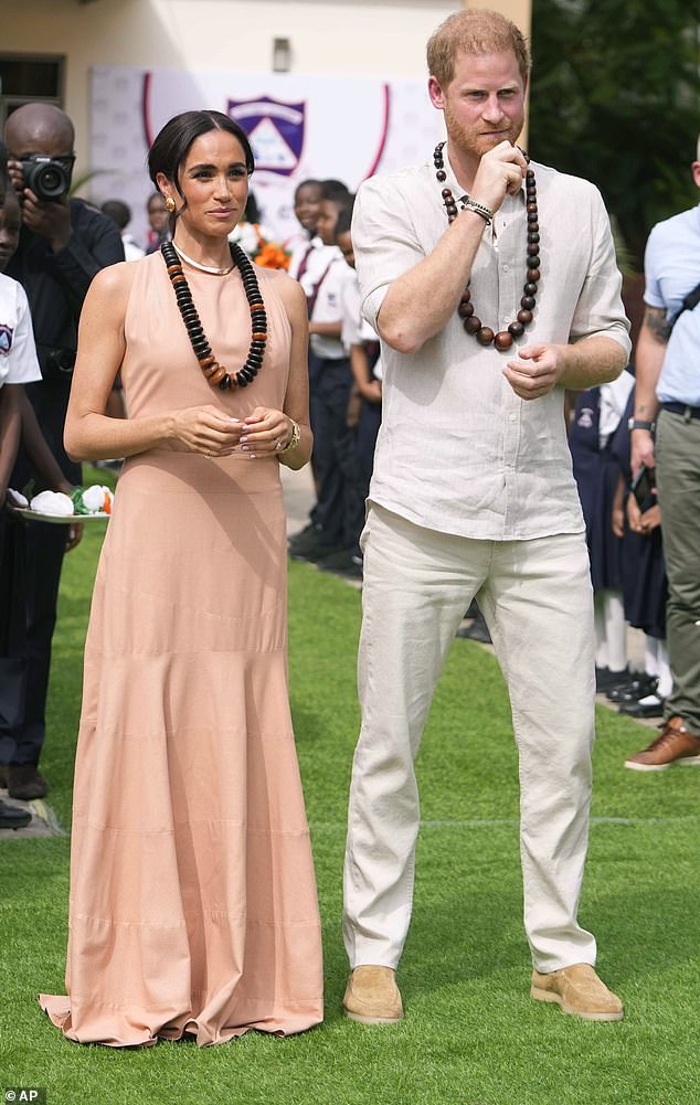 Prince Harry's tour of Nigeria with his wife Meghan Markle comes 34 years after Princess Diana visited the country with Prince Charles. Above: The couple visit children at the Lights Academy in Abuja today